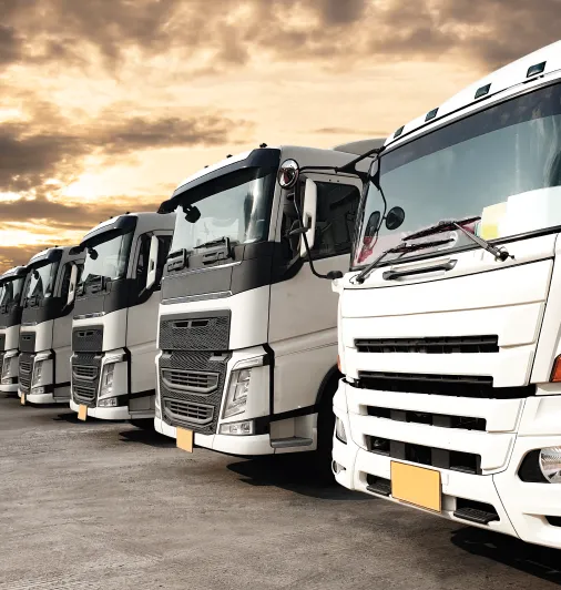 649aba01edcdef49d6710a2c_trucks-parked-lined-up-sunset-sky-road-freight-industry-logistics-transport 1 649aba01edcdef49d6710a2c_trucks-parked-lined-up-sunset-sky-road-freight-industry-logistics-transport 1